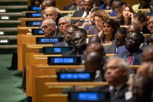 Diplomats seated at the General Assembly hall of the United Nations.