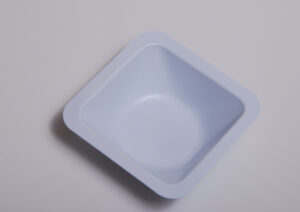 Shows a disposable weighing boat/tray.