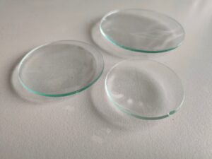 Shows various sizes of watch glasses.