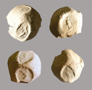 Four views of a clay bulla with multiple seal impressions from Seleucia-on-the-Tigris.