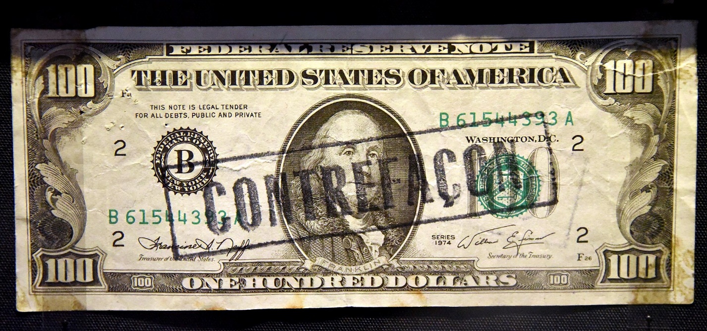 Counterfeit Series 1974 one-hundred-dollar bill overprinted with a "counterfeit" stamp (British Museum exhibit)